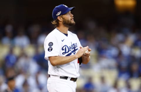 LOS ANGELES, CALIFORNIA - OCTOBER 12: Clayton Kershaw #22 of the Los Angeles Dodgers reacts after giving up a home run to Manny Machado #13 of the San Diego Padres in the first inning in game two of the National League Division Series at Dodger Stadium on October 12, 2022 in Los Angeles, California. (Photo by Ronald Martinez/Getty Images)