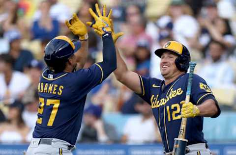 LOS ANGELES, CALIFORNIA - AUGUST 24: Willy Adames #27 of the Milwaukee Brewers celebrates his solo homerun with Hunter Renfroe #12, to take a 1-0 lead over the Los Angeles Dodgers, during the first inning at Dodger Stadium on August 24, 2022 in Los Angeles, California. (Photo by Harry How/Getty Images)