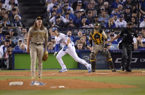 LOS ANGELES, CALIFORNIA - OCTOBER 11: Trea Turner #6 of the Los Angeles Dodgers hits a double during the third inning in game one of the National League Division Series against the San Diego Padres at Dodger Stadium on October 11, 2022 in Los Angeles, California. (Photo by Kevork Djansezian/Getty Images)