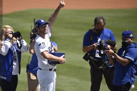 Apr 9, 2021; Los Angeles, California, USA; Los Angeles Dodgers starting pitcher Clayton Kershaw (22) gestures after receiving his championship ring during the 2020 World Series Championship ceremony before the game against the Washington Nationals at Dodger Stadium. Mandatory Credit: Kelvin Kuo-USA TODAY Sports