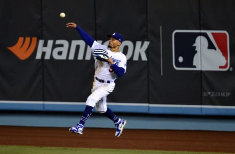 Sep 22, 2020; Los Angeles, California, USA; Los Angeles Dodgers right fielder Mookie Betts (50) throws to the infield after catching a hit off Oakland Athletics right fielder Stephen Piscotty (25) during the ninth inning at Dodger Stadium. Mandatory Credit: Gary A. Vasquez-USA TODAY Sports