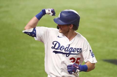 Oct 7, 2020; Arlington, Texas, USA; Los Angeles Dodgers center fielder Cody Bellinger (35) celebrates after hitting a solo home run off of San Diego Padres starting pitcher Zach Davies (not pictured) during the fourth inning in game two of the 2020 NLDS at Globe Life Field. Mandatory Credit: Kevin Jairaj-USA TODAY Sports