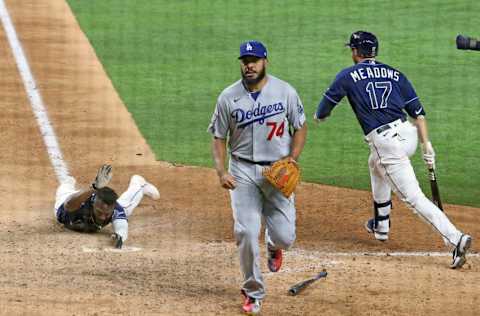 Oct 24, 2020; Arlington, Texas, USA; Tampa Bay Rays left fielder Randy Arozarena (56) scores as Los Angeles Dodgers relief pitcher Kenley Jansen (74) looks on during the ninth inning during game four of the 2020 World Series at Globe Life Field. Mandatory Credit: Kevin Jairaj-USA TODAY Sports