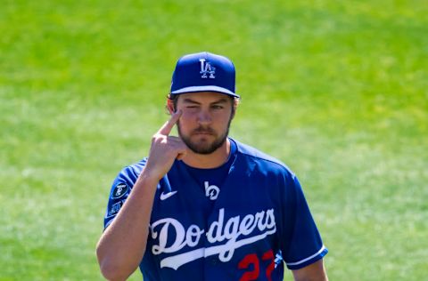 Mar 6, 2021; Glendale, Arizona, USA; Los Angeles Dodgers pitcher Trevor Bauer points at his closed eye after pitching the first inning with it closed against the San Diego Padres during a Spring Training game at Camelback Ranch Glendale. Mandatory Credit: Mark J. Rebilas-USA TODAY Sports