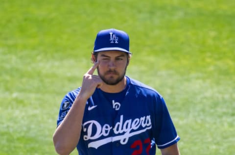 Mar 6, 2021; Glendale, Arizona, USA; Los Angeles Dodgers pitcher Trevor Bauer points at his closed eye after pitching the first inning with it closed against the San Diego Padres during a Spring Training game at Camelback Ranch Glendale. Mandatory Credit: Mark J. Rebilas-USA TODAY Sports