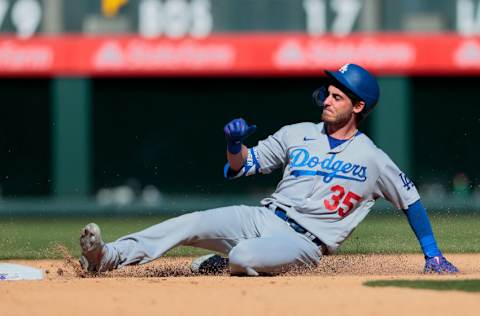 Apr 1, 2021; Denver, Colorado, USA; Los Angeles Dodgers center fielder Cody Bellinger (35) slides safely in to second on a double in the fifth inning against the Colorado Rockies at Coors Field. Mandatory Credit: Isaiah J. Downing-USA TODAY Sports