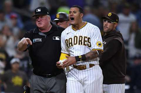 Aug 20, 2021; San Diego, California, USA; San Diego Padres third baseman Manny Machado (second from right) reacts after being ejected during the eighth inning against the Philadelphia Phillies at Petco Park. Mandatory Credit: Orlando Ramirez-USA TODAY Sports