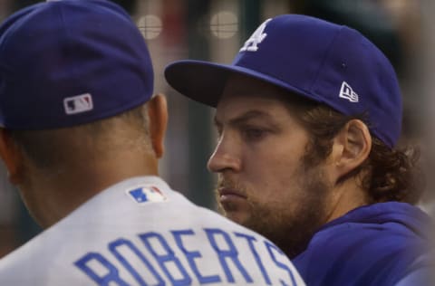 Jul 1, 2021; Washington, District of Columbia, USA; Los Angeles Dodgers starting pitcher Trevor Bauer (R) talks with Dodgers manager Dave Roberts (L) in the dugout against the Washington Nationals in the third inning at Nationals Park. Mandatory Credit: Geoff Burke-USA TODAY Sports