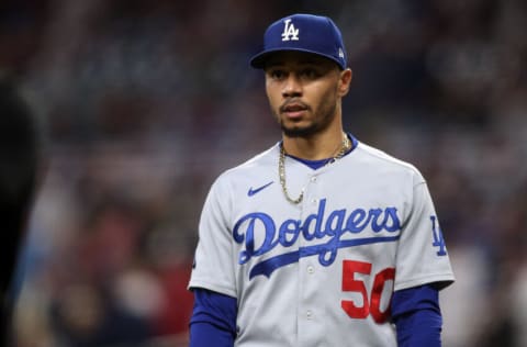 Oct 16, 2021; Cumberland, Georgia, USA; Los Angeles Dodgers right fielder Mookie Betts (50) walks out to the field before game one of the 2021 NLCS against the Atlanta Braves at Truist Park. Mandatory Credit: Brett Davis-USA TODAY Sports