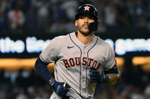 Aug 4, 2021; Los Angeles, California, USA; Houston Astros shortstop Carlos Correa (1) reacts after hitting a solo home run against the Los Angeles Dodgers during the eighth inning at Dodger Stadium. Mandatory Credit: Richard Mackson-USA TODAY Sports