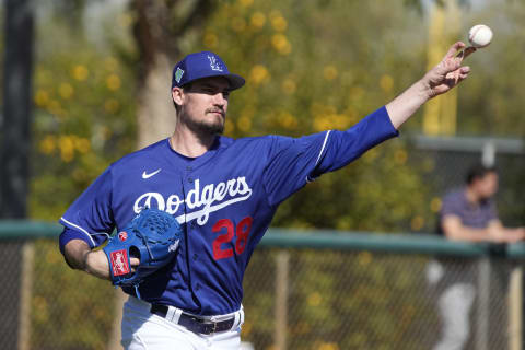 Los Angeles Dodgers pitcher Andrew Heaney (28) throws to first base during spring training camp at Camelback Ranch. Mandatory Credit: Rick Scuteri-USA TODAY Sports