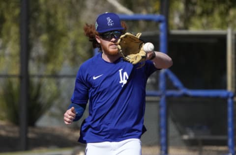 Mar 15, 2022; Glendale, AZ, USA; Los Angeles Dodgers pitcher Dustin May (85) covers the base during spring training camp at Camelback Ranch. Mandatory Credit: Rick Scuteri-USA TODAY Sports