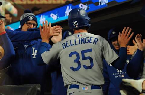 Sep 16, 2022; San Francisco, California, USA; Los Angeles Dodgers center fielder Cody Bellinger (35) high fives teammates in the dugout after scoring a run against the San Francisco Giants during the fourth inning at Oracle Park. Mandatory Credit: Kelley L Cox-USA TODAY Sports