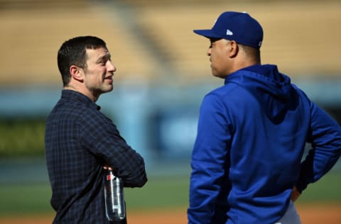 Oct 21, 2021; Los Angeles, California, USA; Los Angeles Dodgers operations president Andrew Friedman speaks with Los Angeles Dodgers manager Dave Roberts (30) before game five of the 2021 NLCS against the Atlanta Braves at Dodger Stadium. Mandatory Credit: Jayne Kamin-Oncea-USA TODAY Sports