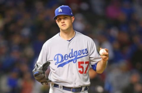 Apr 10, 2017; Chicago, IL, USA; Los Angeles Dodgers starting pitcher Alex Wood (57) reacts to committing a throwing error during the fourth inning against the Chicago Cubs at Wrigley Field. Mandatory Credit: Dennis Wierzbicki-USA TODAY Sports