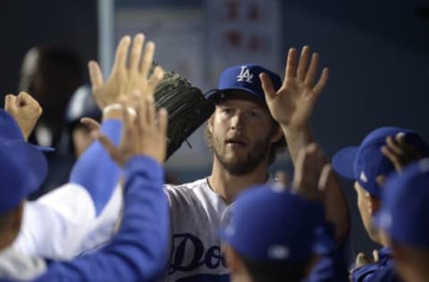 April 14, 2017; Los Angeles, CA, USA; Los Angeles Dodgers starting pitcher Clayton Kershaw (22) is greeted after being relieved in the ninth inning against the Arizona Diamondbacks at Dodger Stadium. Mandatory Credit: Gary A. Vasquez-USA TODAY Sports