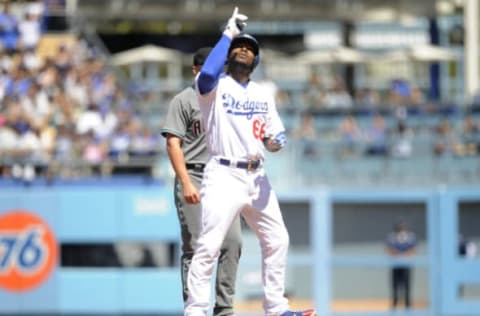 April 16, 2017; Los Angeles, CA, USA; Los Angeles Dodgers right fielder Yasiel Puig (66) reaches second on an RBI double in the fourth inning against the Arizona Diamondbacks at Dodger Stadium. Mandatory Credit: Gary A. Vasquez-USA TODAY Sports