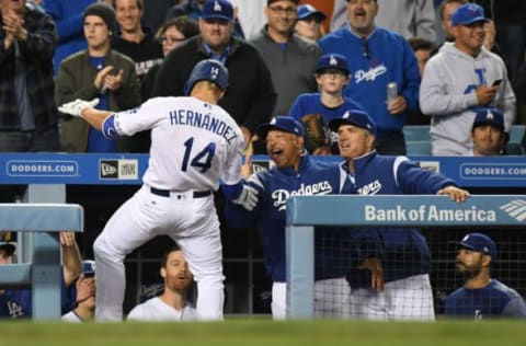 Apr 17, 2017; Los Angeles, CA, USA; Los Angeles Dodgers center fielder Enrique Hernandez (14) is congratulated by manager Dave Roberts (center) and bench coach Bob Geren (right) for hitting a solo home run against the Arizona Diamondbacks during the fourth inning at Dodger Stadium. Mandatory Credit: Richard Mackson-USA TODAY Sports