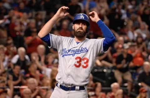 Apr 22, 2017; Phoenix, AZ, USA; Los Angeles Dodgers left fielder Scott Van Slyke (33) reacts to a close call at first base resulting in a third out in the sixth inning against the Arizona Diamondbacks at Chase Field. The call was overturned and Van Slyke scored a run. Mandatory Credit: Jennifer Stewart-USA TODAY Sports