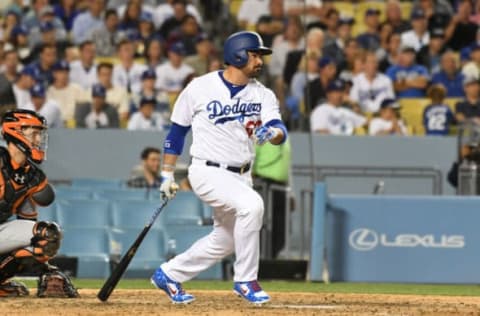 May 1, 2017; Los Angeles, CA, USA; Los Angeles Dodgers first baseman Adrian Gonzalez (23) hits a single against the San Francisco Giants in the seventh inning at Dodger Stadium. Mandatory Credit: Richard Mackson-USA TODAY Sports