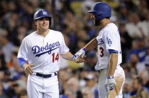 May 2, 2017; Los Angeles, CA, USA; Los Angeles Dodgers center fielder Enrique Hernandez (14) is greeted by second baseman Chris Taylor (3) after scoring a run in the fourth inning against the San Francisco Giants at Dodger Stadium. Mandatory Credit: Gary A. Vasquez-USA TODAY Sports