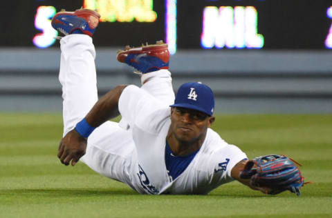 May 10, 2017; Los Angeles, CA, USA; Los Angeles Dodgers right fielder Yasiel Puig (66) cannot come up with a double hit by Pittsburgh Pirates catcher Francisco Cervelli (not pictured) in the sixth inning at Dodger Stadium. Mandatory Credit: Jayne Kamin-Oncea-USA TODAY Sports