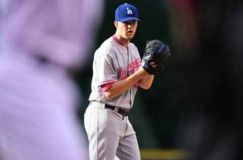 May 13, 2017; Denver, CO, USA; Los Angeles Dodgers starting pitcher Alex Wood (57) prepares to deliver a pitch in the first inning Colorado Rockies at Coors Field. Mandatory Credit: Ron Chenoy-USA TODAY Sports