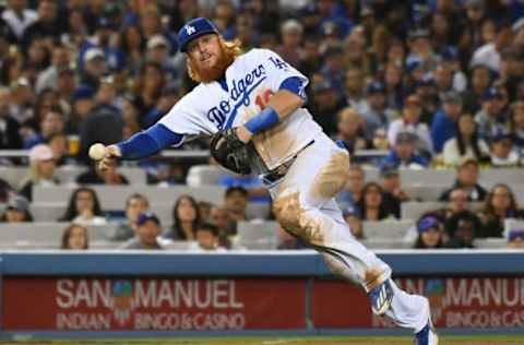 May 18, 2017; Los Angeles, CA, USA; Los Angeles Dodgers third baseman Justin Turner (10) throws on the run after fielding a ball hit by Miami Marlins first baseman Justin Bour (not pictured) at first in the sixth inning at Dodger Stadium. Turner’s throw was not in time to retire Bour who reached on an infield single on the play. Mandatory Credit: Richard Mackson-USA TODAY Sports