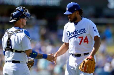 May 21, 2017; Los Angeles, CA, USA; Los Angeles Dodgers catcher Yasmani Grandal (9) and relief pitcher Kenley Jansen (74) celebrate the victory against the Miami Marlins at Dodger Stadium. Mandatory Credit: Gary A. Vasquez-USA TODAY Sports