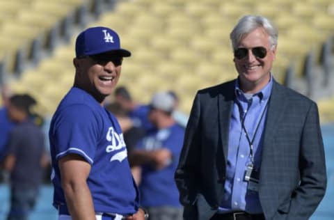 osMay 24, 2017; Los Angeles, CA, USA; Los Angeles Dodgers manager Dave Roberts (L) talks with Dodgers chief executive officer Mark Walter (R) before their game against the St. Louis Cardinals at Dodger Stadium. Mandatory Credit: Kirby Lee-USA TODAY Sports