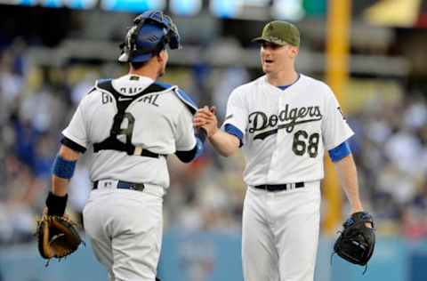 May 27, 2017; Los Angeles, CA, USA; Los Angeles Dodgers relief pitcher Ross Stripling (68) and catcher Yasmani Grandal (9) celebrate the shut out victory against the Chicago Cubs at Dodger Stadium. Mandatory Credit: Gary A. Vasquez-USA TODAY Sports