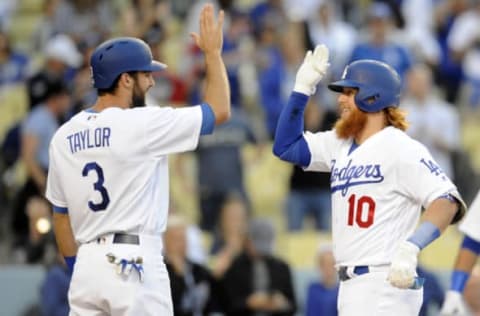 Jun 9, 2017; Los Angeles, CA, USA; Los Angeles Dodgers third baseman Justin Turner (10) is greeted by Los Angeles Dodgers center fielder Chris Taylor (3) after hitting a two-run home run in the first inning at Dodger Stadium. Mandatory Credit: Gary A. Vasquez-USA TODAY Sports