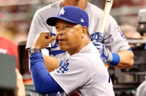 Jun 16, 2017; Cincinnati, OH, USA; Los Angeles Dodgers manager Dave Roberts watches during the ninth inning against the Cincinnati Reds at Great American Ball Park. Mandatory Credit: David Kohl-USA TODAY Sports