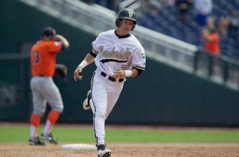 Jun 15, 2015; Omaha, NE, USA; Vanderbilt Commodores runner Jeren Kendall (3) rounds the bases after hitting the game-winning homer against the Cal State Fullerton Titans during the ninth inning of the College World Series at TD Ameritrade Park. Vanderbilt won 4-3. Mandatory Credit: Bruce Thorson-USA TODAY Sports