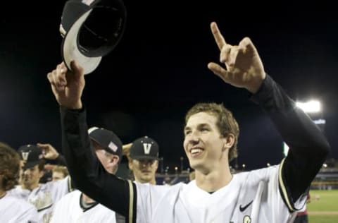 Jun 19, 2015; Omaha, NE, USA; Vanderbilt Commodores pitcher Walker Buehler (13) celebrates after defeating the TCU Horned Frogs in the 2015 College World Series at TD Ameritrade Park. Vanderbilt won 7-1. Mandatory Credit: Bruce Thorson-USA TODAY Sports