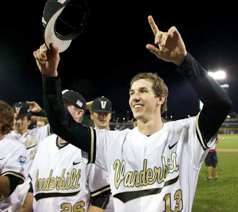 Jun 19, 2015; Omaha, NE, USA; Vanderbilt Commodores pitcher Walker Buehler (13) celebrates after defeating the TCU Horned Frogs in the 2015 College World Series at TD Ameritrade Park. Vanderbilt won 7-1. Mandatory Credit: Bruce Thorson-USA TODAY Sports