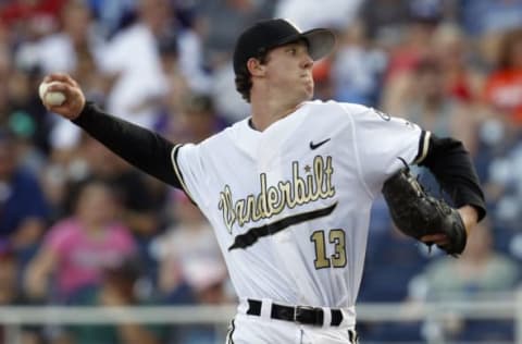 Jun 24, 2015; Omaha, NE, USA; Vanderbilt Commodores pitcher Walker Buehler (13) throws during the first inning against the Virginia Cavaliers in game three of the College World Series Finals at TD Ameritrade Park. Mandatory Credit: Bruce Thorson-USA TODAY Sports