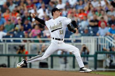 Jun 24, 2015; Omaha, NE, USA; Vanderbilt Commodores pitcher Walker Buehler (13) throws during the first inning against the Virginia Cavaliers in game three of the College World Series Finals at TD Ameritrade Park. Mandatory Credit: Bruce Thorson-USA TODAY Sports