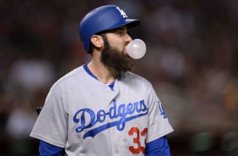 Jul 15, 2016; Phoenix, AZ, USA; Los Angeles Dodgers left fielder Scott Van Slyke (33) blows a bubble after striking out during the sixth inning against the Arizona Diamondbacks at Chase Field. Mandatory Credit: Joe Camporeale-USA TODAY Sports