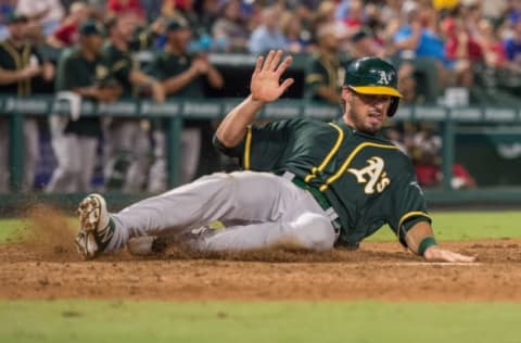 Aug 16, 2016; Arlington, TX, USA; Oakland Athletics right fielder Brett Eibner (39) scores during the tenth inning against the Texas Rangers at Globe Life Park in Arlington. The Rangers defeat the Athletics 5-4 in ten innings. Mandatory Credit: Jerome Miron-USA TODAY Sports