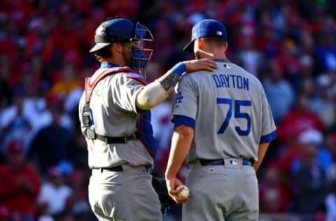 Oct 9, 2016; Washington, DC, USA; Los Angeles Dodgers catcher Yasmani Grandal (9) talks with Los Angeles Dodgers relief pitcher Grant Dayton (75) in between pitches against the Washington Nationals during the seventh inning of game two of the 2016 NLDS playoff baseball series at Nationals Park. Mandatory Credit: Brad Mills-USA TODAY Sports