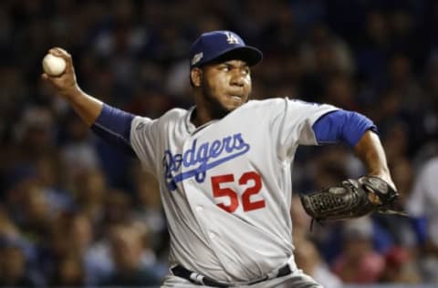 Oct 15, 2016; Chicago, IL, USA; Los Angeles Dodgers relief pitcher Pedro Baez (52) throws against the Chicago Cubs during the fifth inning of game one of the 2016 NLCS playoff baseball series at Wrigley Field. Mandatory Credit: Jon Durr-USA TODAY Sports