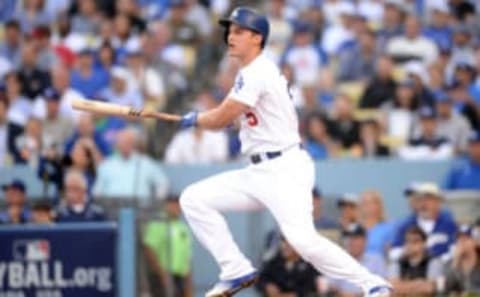 Oct 18, 2016; Los Angeles, CA, USA; Los Angeles Dodgers shortstop Corey Seager (5) hits a single during the first inning against the Chicago Cubs in game three of the 2016 NLCS playoff baseball series at Dodger Stadium. Mandatory Credit: Gary A. Vasquez-USA TODAY Sports