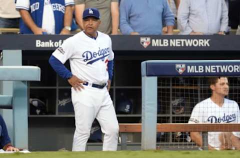 Oct 19, 2016; Los Angeles, CA, USA; Los Angeles Dodgers manager Dave Roberts (30) reacts against the Chicago Cubs in the second inning during game four of the 2016 NLCS playoff baseball series at Dodger Stadium. Mandatory Credit: Gary A. Vasquez-USA TODAY Sports