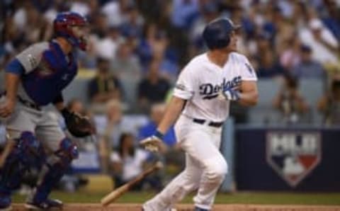 Oct 20, 2016; Los Angeles, CA, USA; Los Angeles Dodgers shortstop Corey Seager (5) singles in the first inning against the Chicago Cubs in game five of the 2016 NLCS playoff baseball series against the Los Angeles Dodgers at Dodger Stadium. Mandatory Credit: Kelvin Kuo-USA TODAY Sports