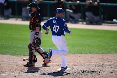 Mar 7, 2017; Phoenix, AZ, USA; Los Angeles Dodgers right fielder Tyler Holt (47) scores a run against the San Francisco Giants during the fourth inning at Camelback Ranch. Mandatory Credit: Joe Camporeale-USA TODAY Sports