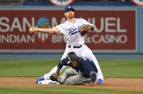 Apr 5, 2017; Los Angeles, CA, USA: Los Angeles Dodgers second baseman Logan Forsythe (11) forces out San Diego Padres center fielder Manuel Margot (7) at second base in the first inning during a MLB baseball game at Dodger Stadium. Mandatory Credit: Kirby Lee-USA TODAY Sports