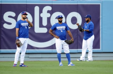 October 17, 2016; Los Angeles, CA, USA; Los Angeles Dodgers right fielder Andre Ethier (16), right fielder Andrew Toles (60) and relief pitcher Pedro Baez (52) during workouts before game three of the NLCS at Dodgers Stadium. Mandatory Credit: Gary A. Vasquez-USA TODAY Sports