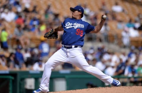 Mar 21, 2017; Phoenix, AZ, USA; Los Angeles Dodgers starting pitcher Hyun-Jin Ryu (99) pitches against the Milwaukee Brewers during the second inning at Camelback Ranch. Mandatory Credit: Joe Camporeale-USA TODAY Sports