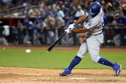 Apr 21, 2017; Phoenix, AZ, USA; Los Angeles Dodgers left fielder Andrew Toles (60) hits an RBI single against the Arizona Diamondbacks during the fifth inning at Chase Field. Mandatory Credit: Joe Camporeale-USA TODAY Sports